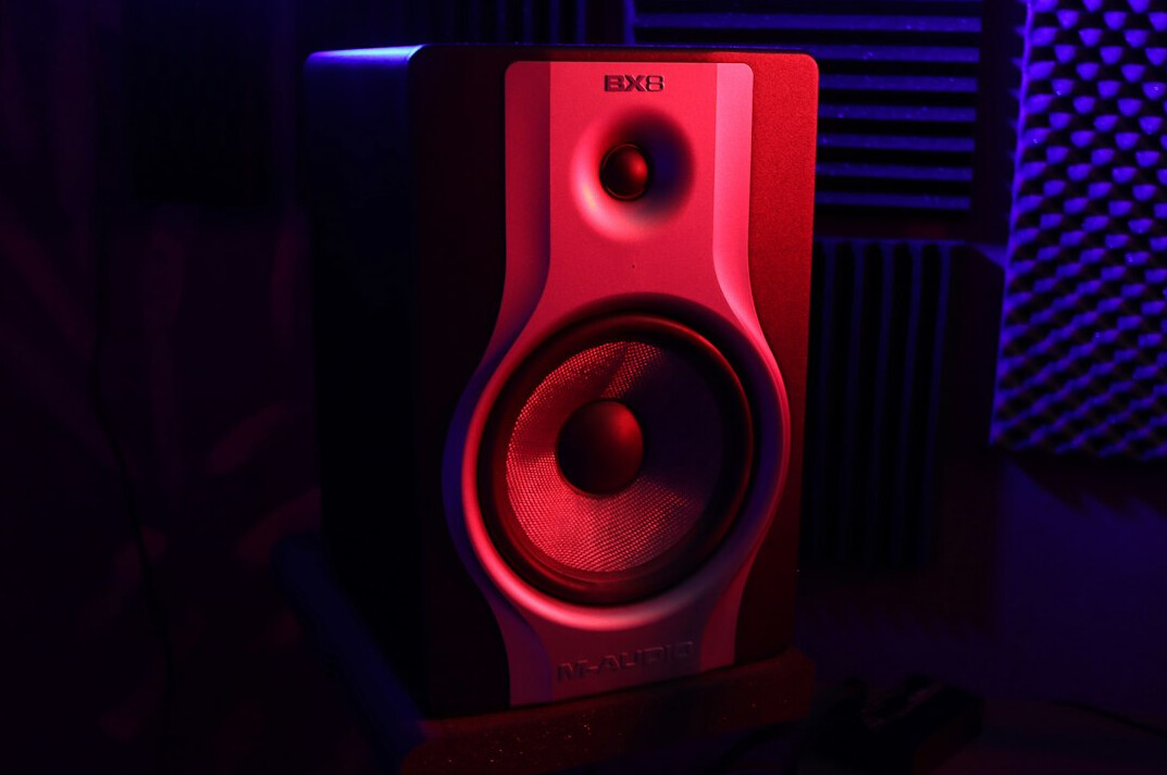 Professional studio microphone in a dim recording studio