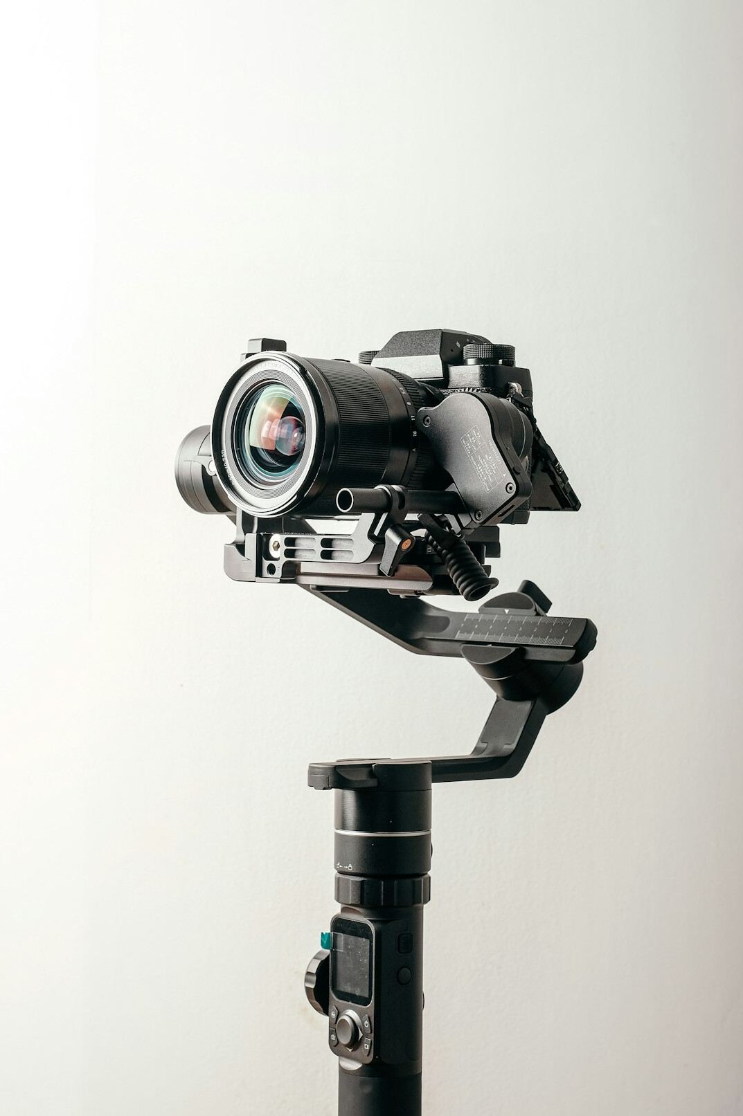 Television studio camera pointed at a news anchor desk